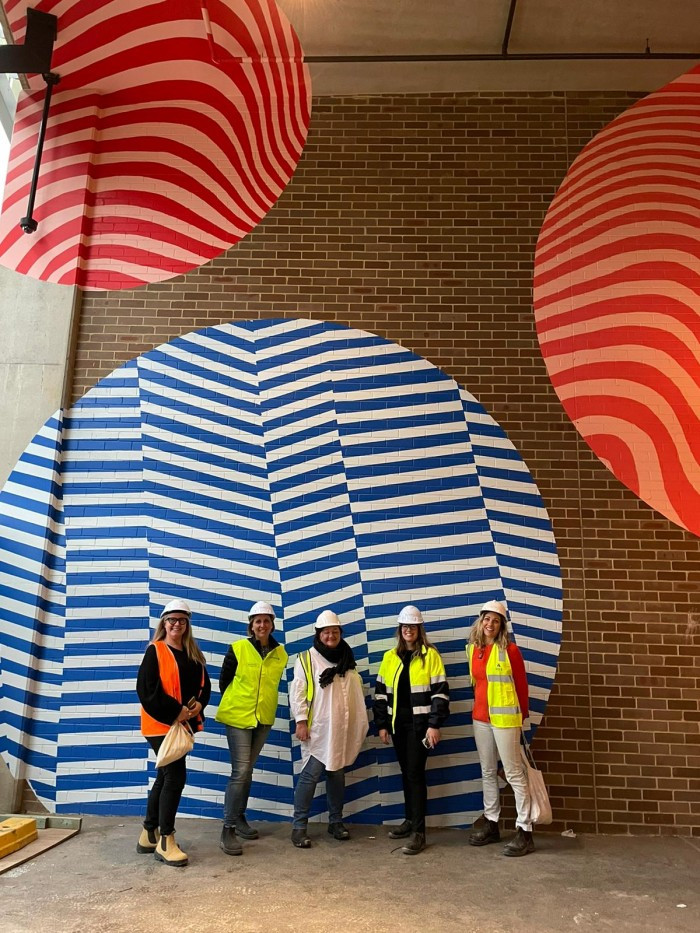 Art Pharmacy and project team in front of Funskull's mural for Marrickville Metro redevelopment, completed May 2021