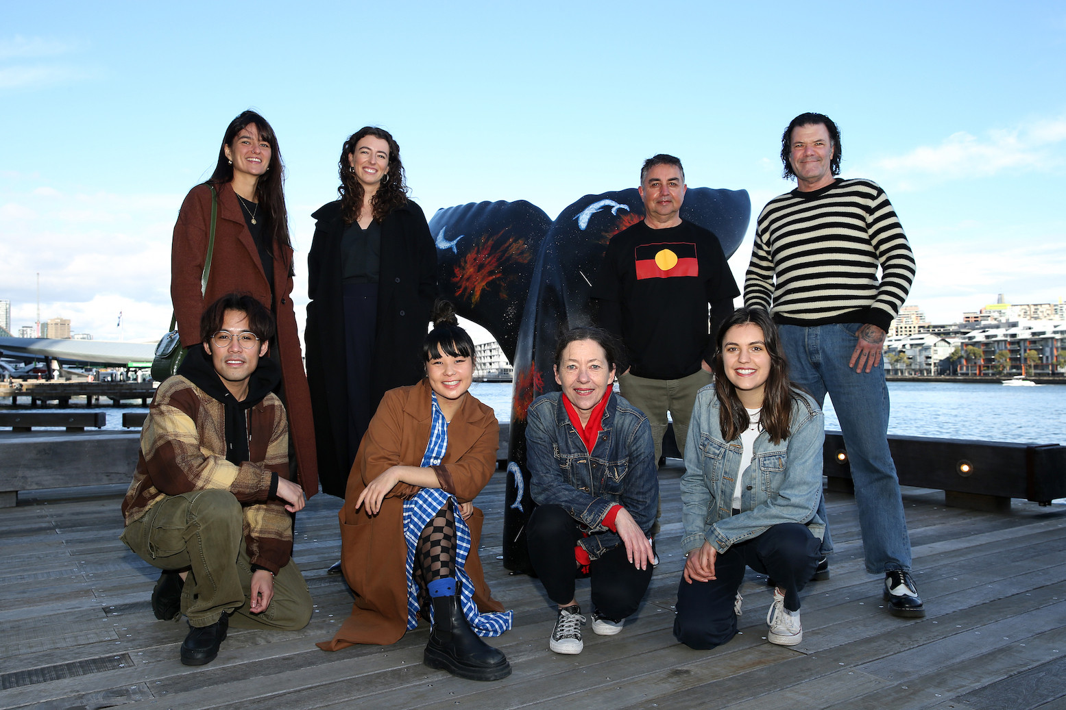 Indigenous Curatorial Advisors Auntie Joanne Selfe and Uncle Graham Toomey with artists and Art Pharmacy team in front of  Graham Toomey’s artwork ‘Whale Dreaming’ for the Whale Tale Public Sculpture Trail.