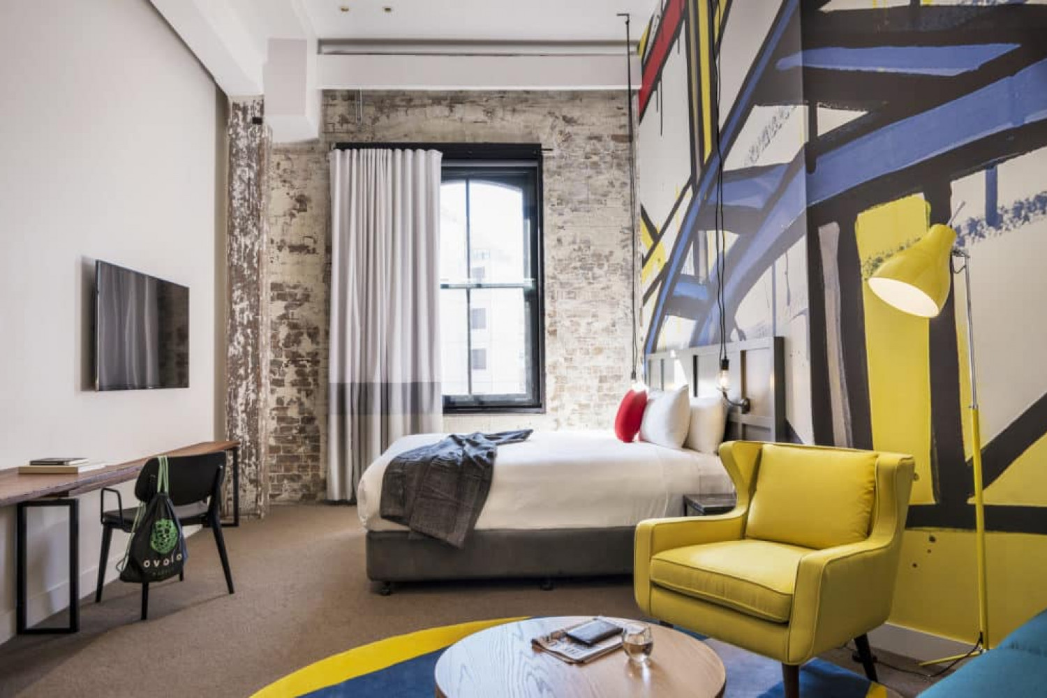 Ovolo 1888 Darling Harbour's rooms have vibrant red, yellow and blue murals by local artist Jasper Knight
