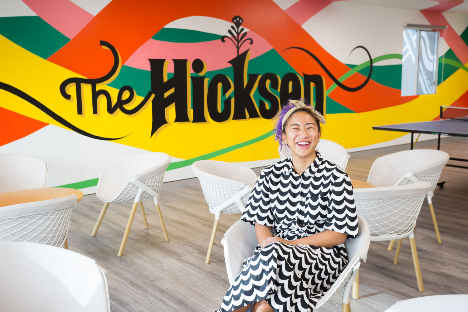Artist Angelica Catalan in front of her mural 'The Hickson'